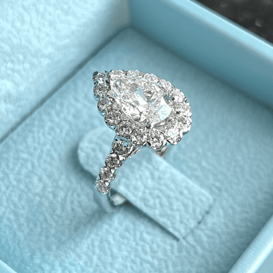 One-of-One Pear Brilliant Diamond Ring w/ Halo & Round Brilliant Side Diamonds