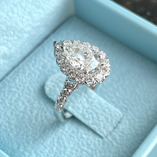 One-of-One Pear Brilliant Diamond Ring w/ Halo & Round Brilliant Side Diamonds