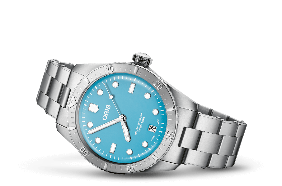 A stainless steel divers watch with a blue dial and strap, featuring a date display and multiple sub-dials.